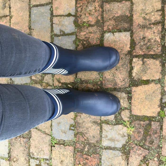 wearing navy wellington boots