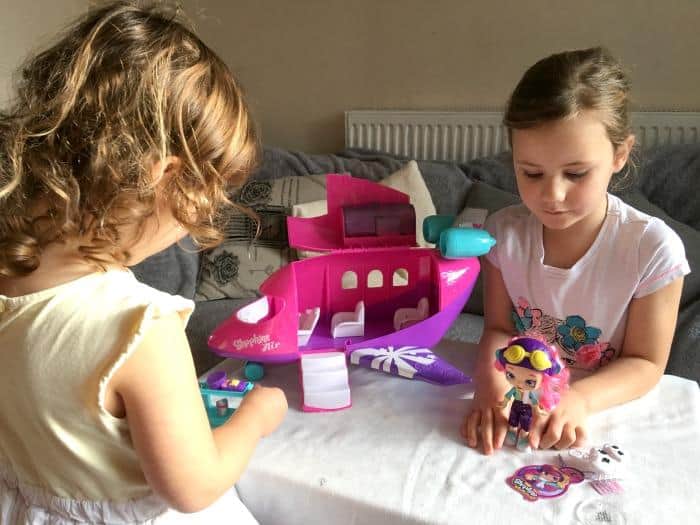 girls playing with shopkins skyanna jet playset