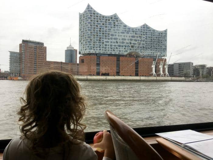 child looking at Elbphilharmonie Hamburg from boat 