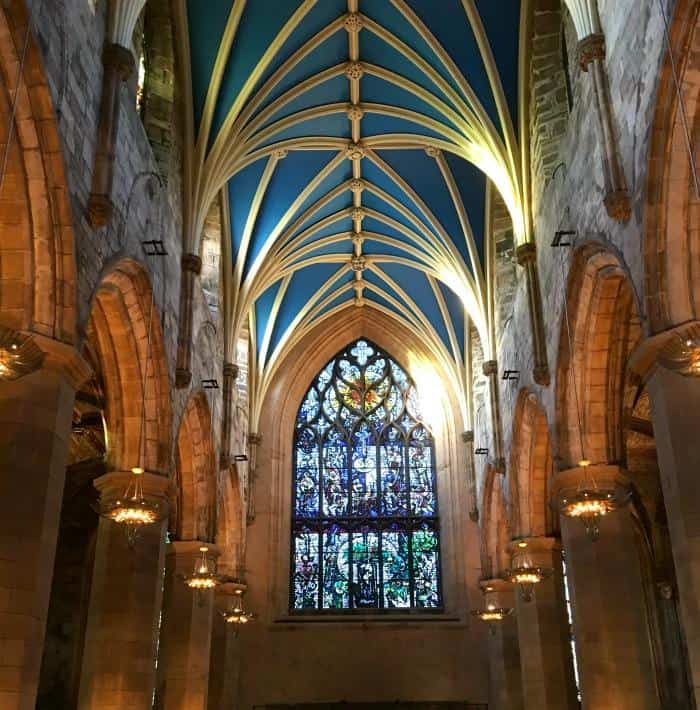 inside St Giles Cathedral Edinburgh showing the roof and stained glass window 