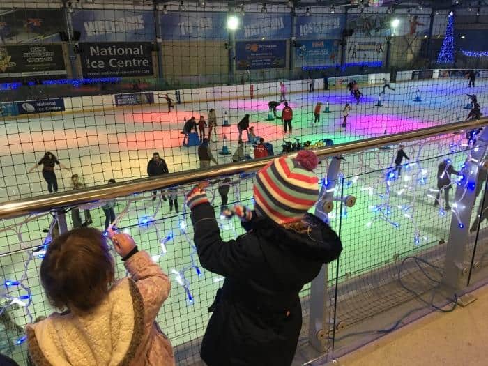 kids watching ice skating