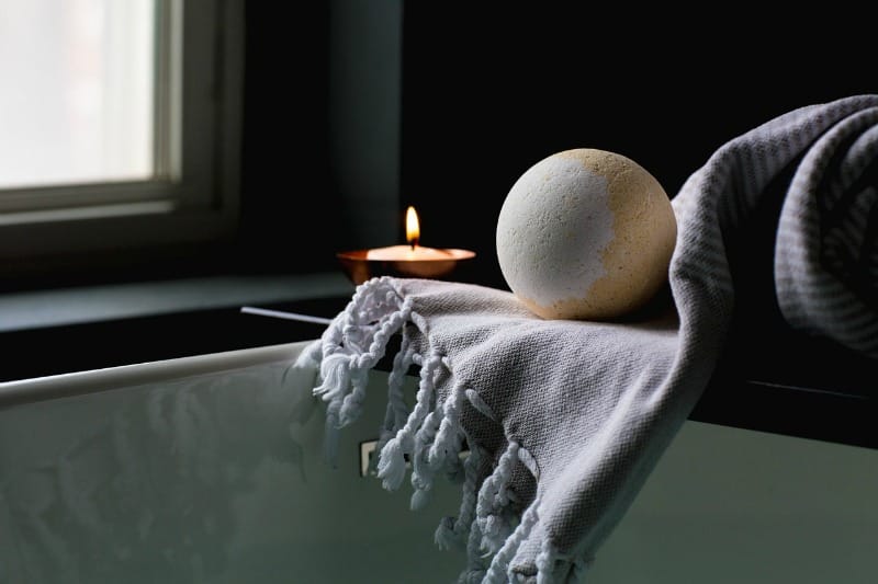 bath candle and towel bath bomb