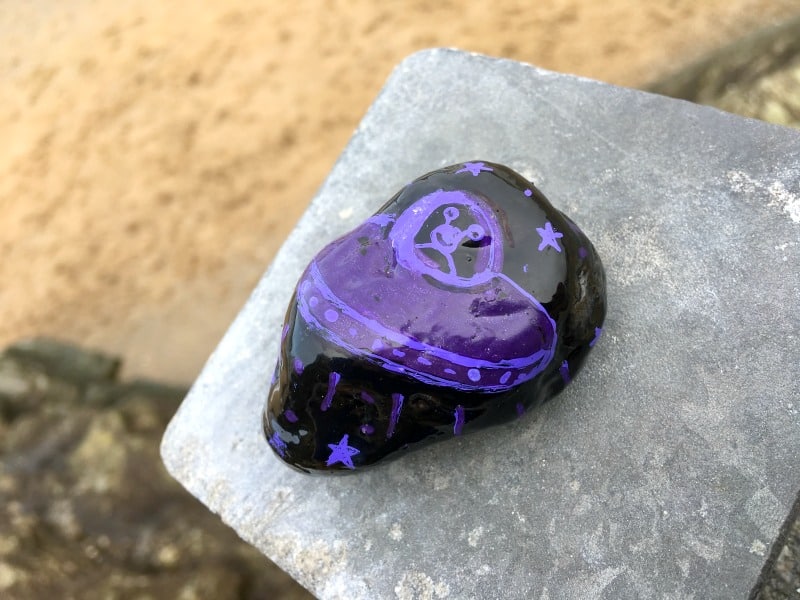 a painted rock on porth beach cornwall UK 