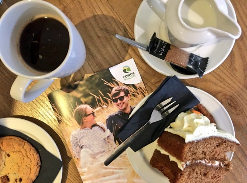 coffee and cake and cofton holidays brochure on table