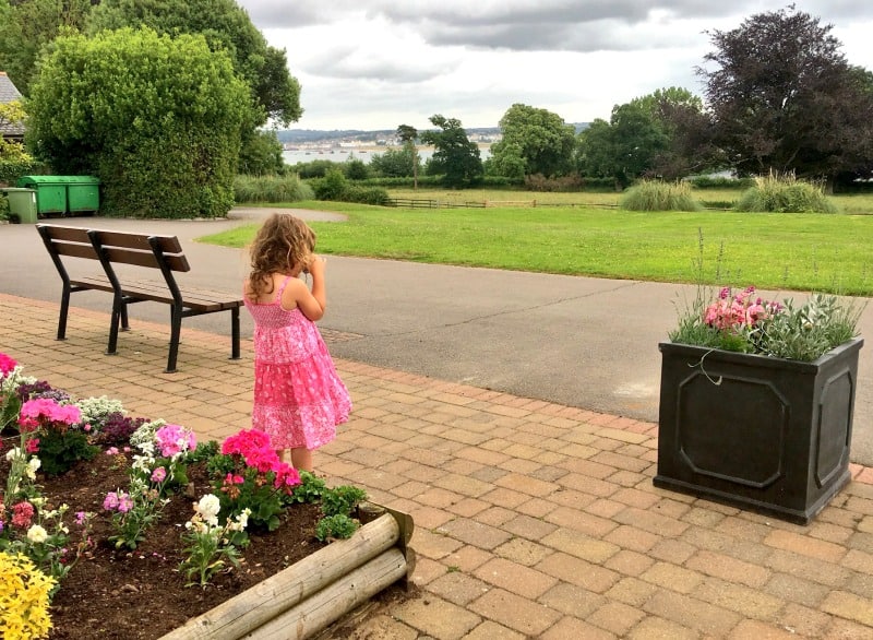 child enjoying view of gardens outside cofton holidays devon apartments 