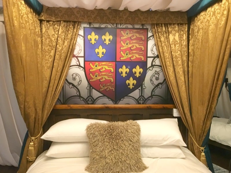 sample medieval double bed inside warwick castle glamping tents 