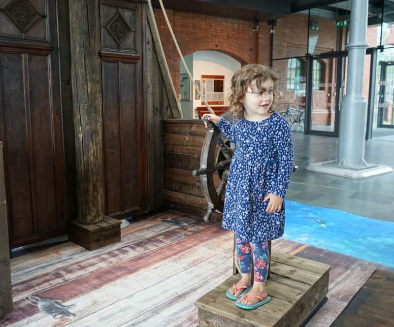 child playing on ship at national waterfront museum swansea