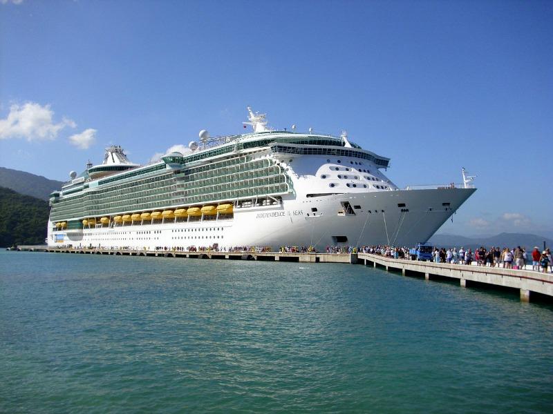independence of the seas royal caribbean cruise ship in port with lines of passengers waiting to go on board