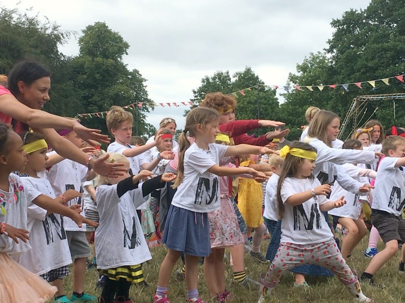 group of children doing warrior dance activity at just so festival