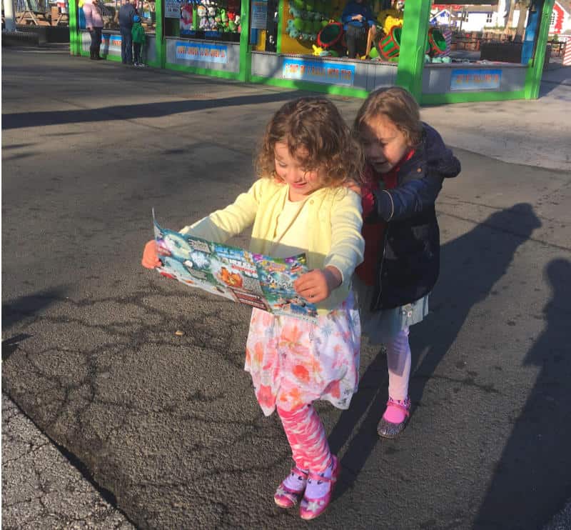 girls looking at theme park map