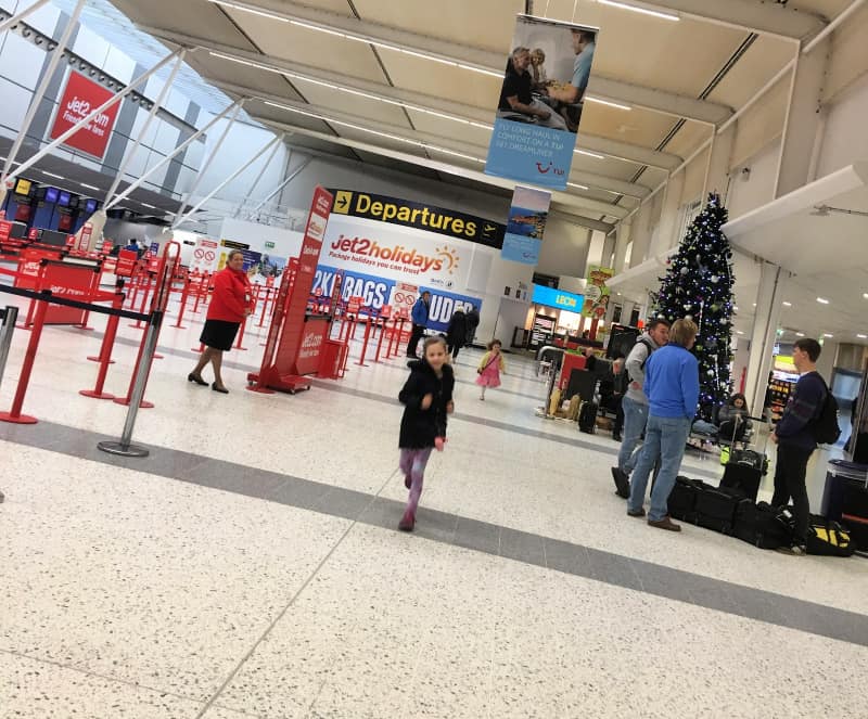 excited kids running in airport before a flight 