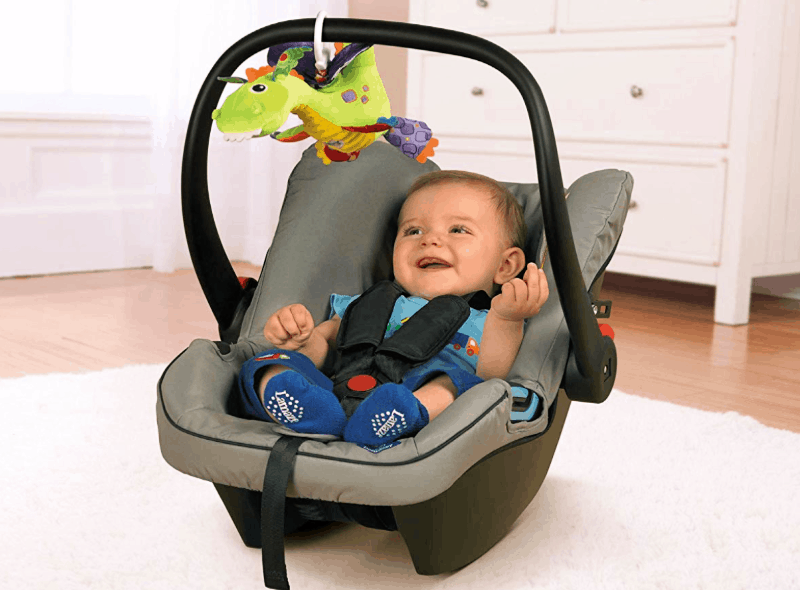 baby in car seat with clip on toy