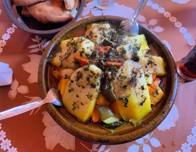 chicken tagine topped with potatoes and herbs