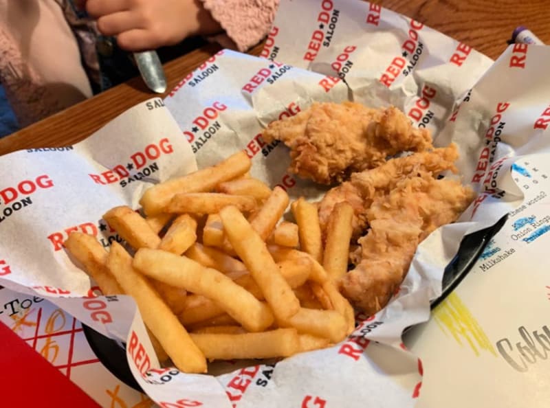 chicken tenders and chips kids meal served in a basket 