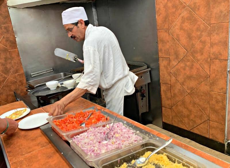 chef making fresh omelettes at Caribbean Village All Inclusive Restaurant
