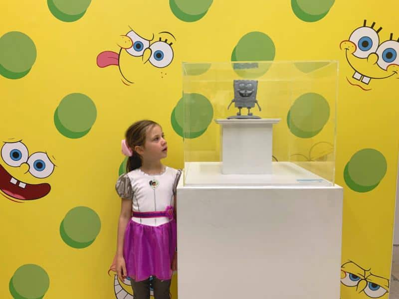 child looking at sponge bob square pants model at nickelodeon exhibition