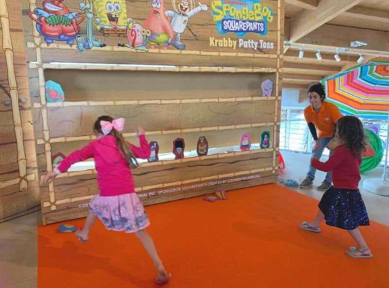 children playing fun fair game at nickelodeon treasure event at malta national aquarium