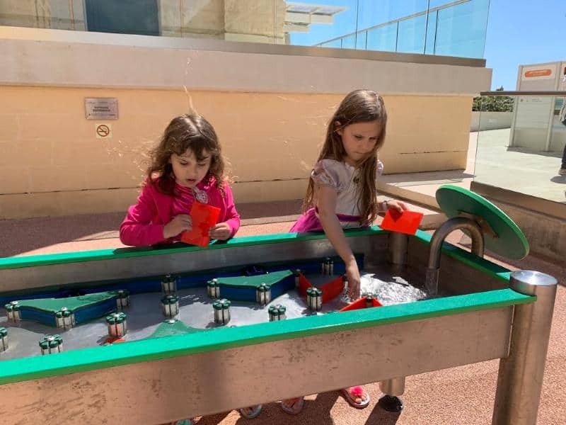 children playing with water activity at esplora science centre in malta