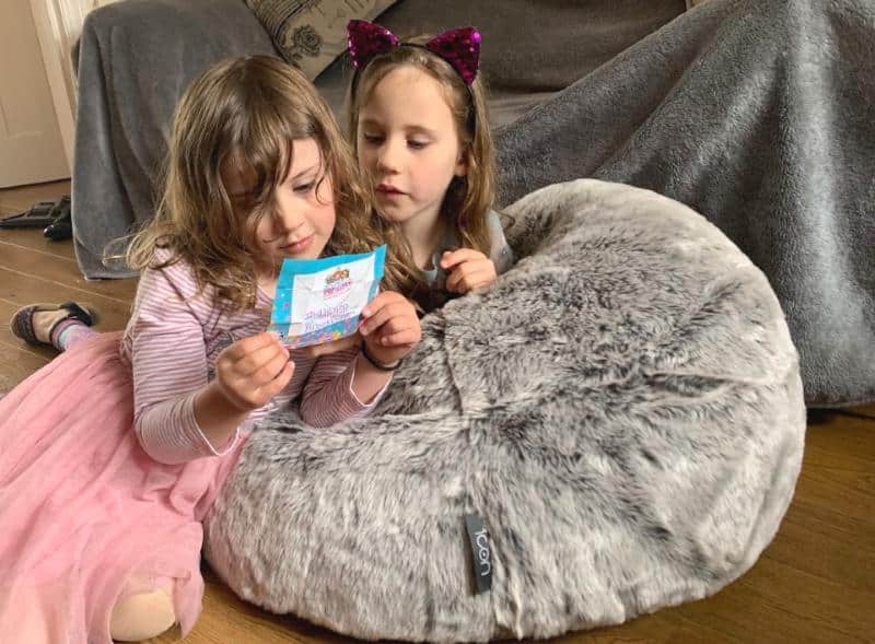 girls sitting on kids fluffy bean bag