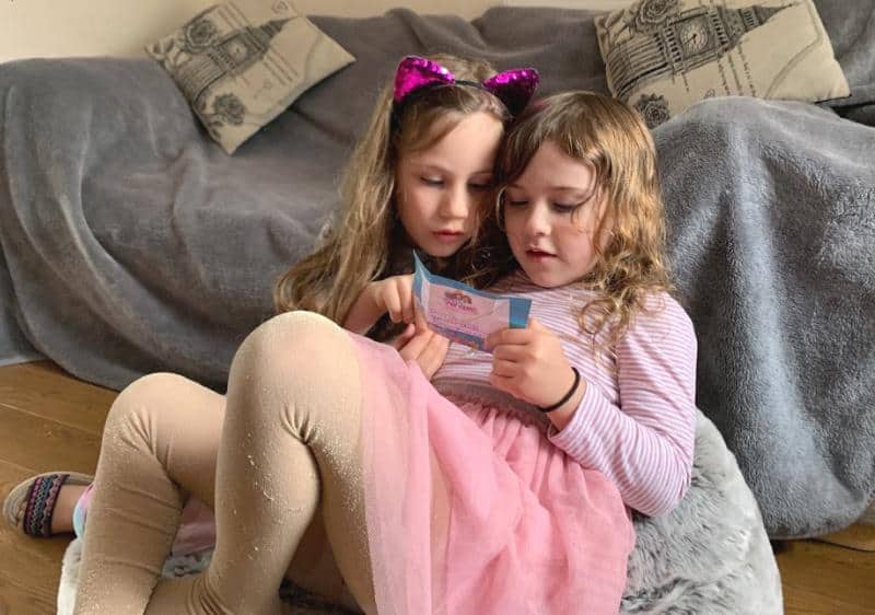 kids sitting on fluffy grey bean bag