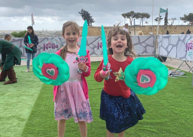 two children with nella the princess knight swords and shields at malta nickelodeon event