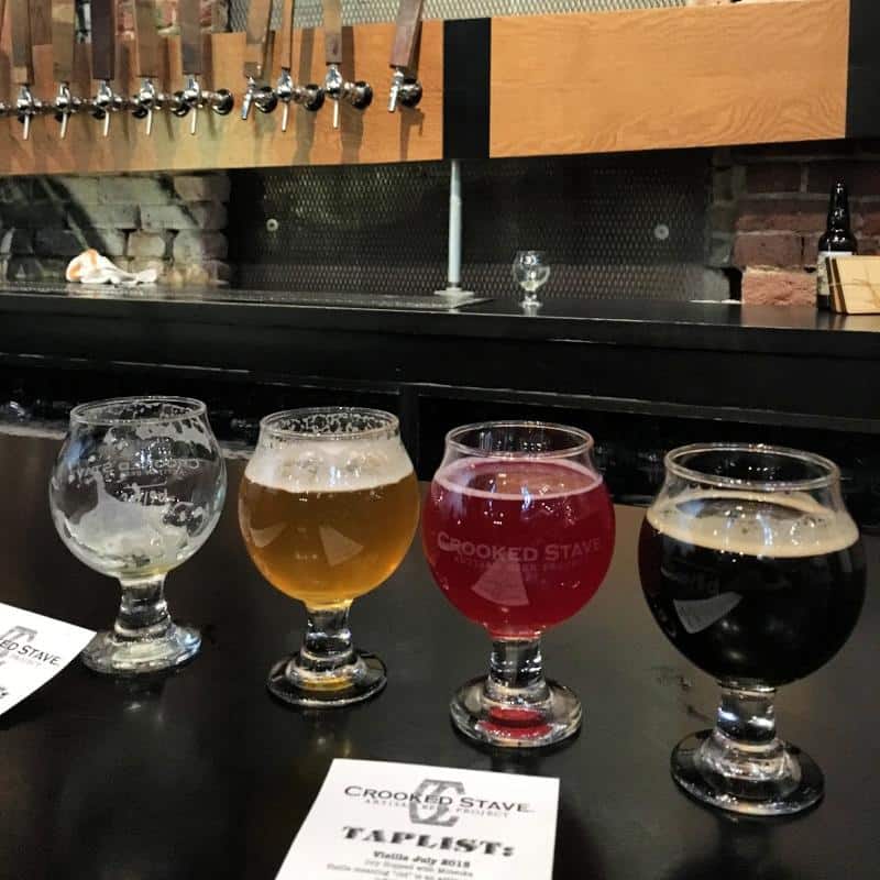 samples of beer in 4 glasses in Denver brewery 