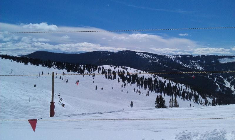 snow covered ski mountains in vail, colorado
