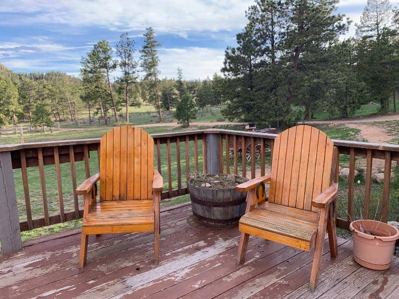 chairs outside with blue skies and trees behind at sundance ranch