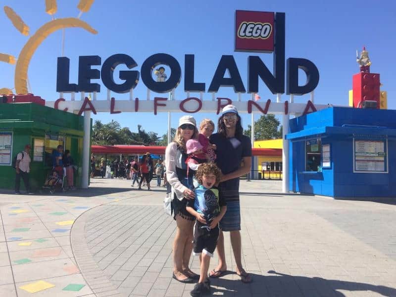 family stood outside Legoland california theme park resort 