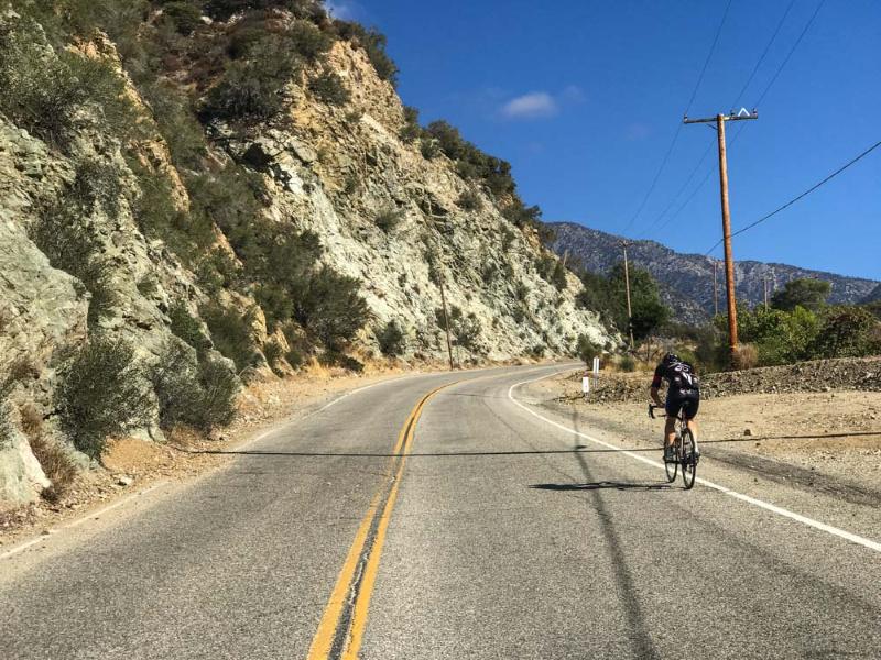 person cycling up Mt Baldy 