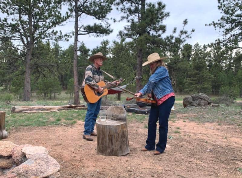singing songs around the campfire at sundance trail guest ranch colorado