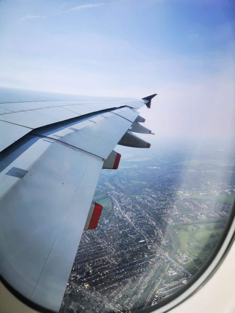 view of city from window seat on plane