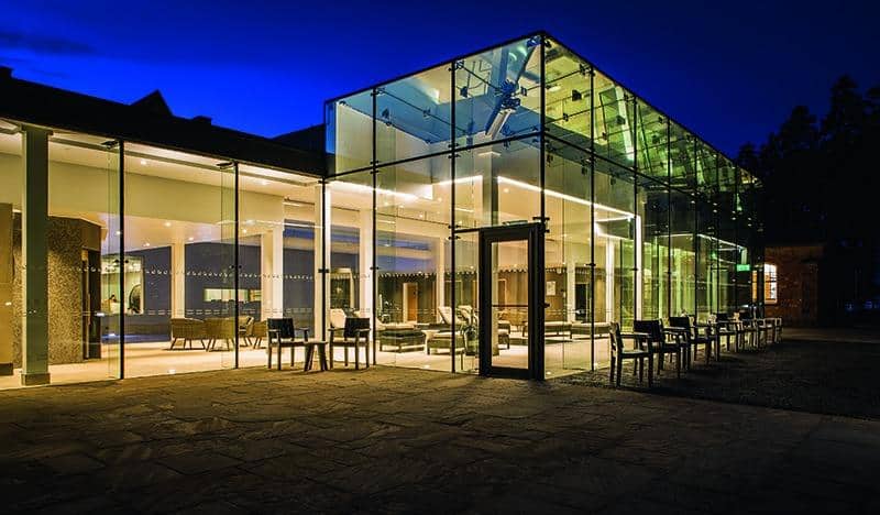 outside the stable spa at studley castle at night 