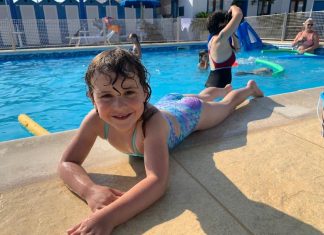 child by the pool in maru swimwear