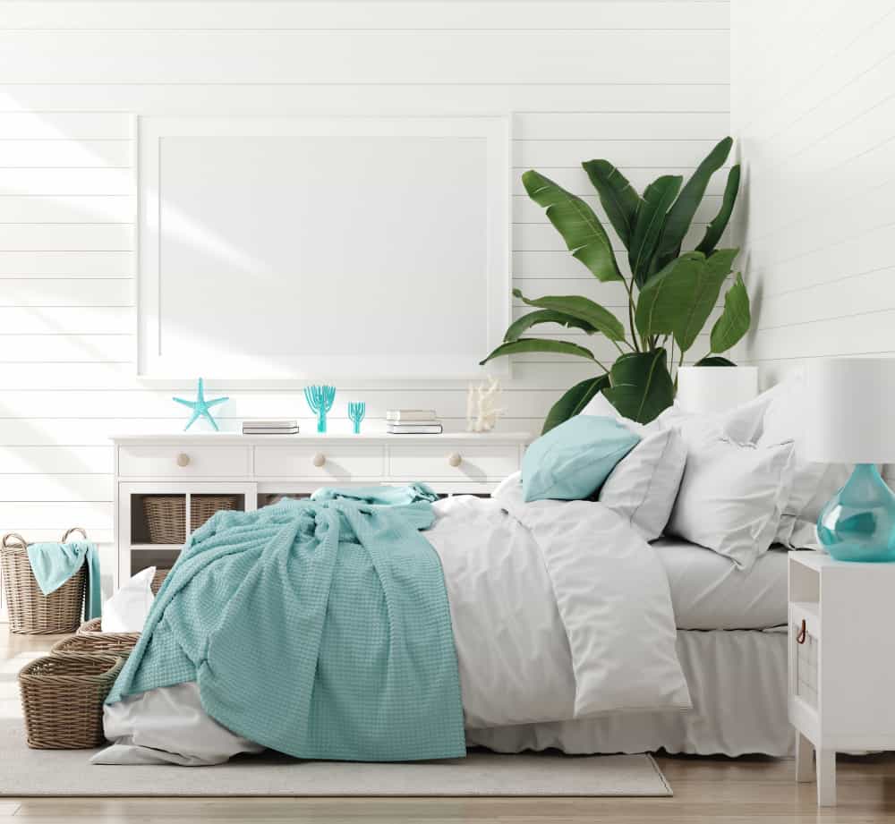 coastal decor in bedroom with white walls and bedding