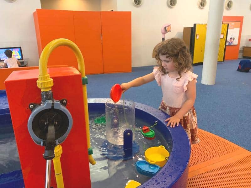 playing with water activity at city of children in genoa copy