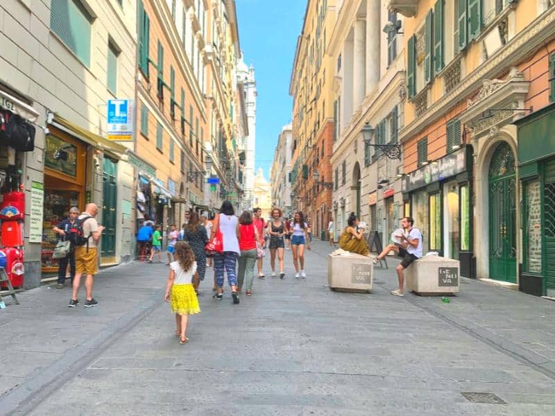 walking down shopping street in genoa italy