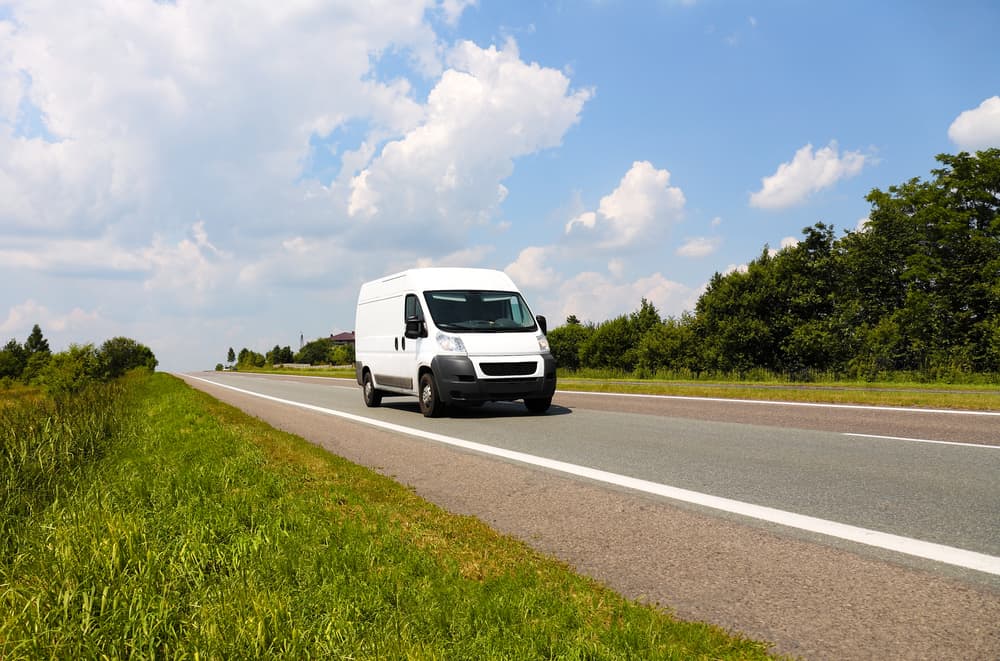 Delivery Van driving on road 