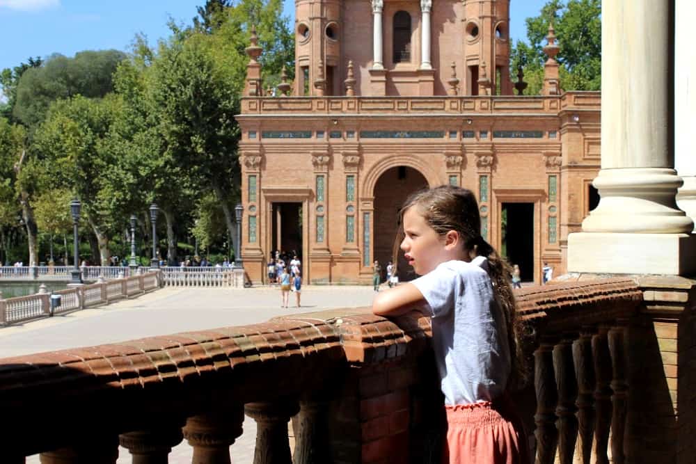 child looking at view over plaza de seville