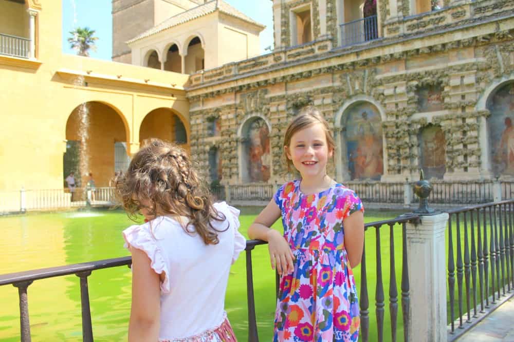 children inside real alcazar seville spain