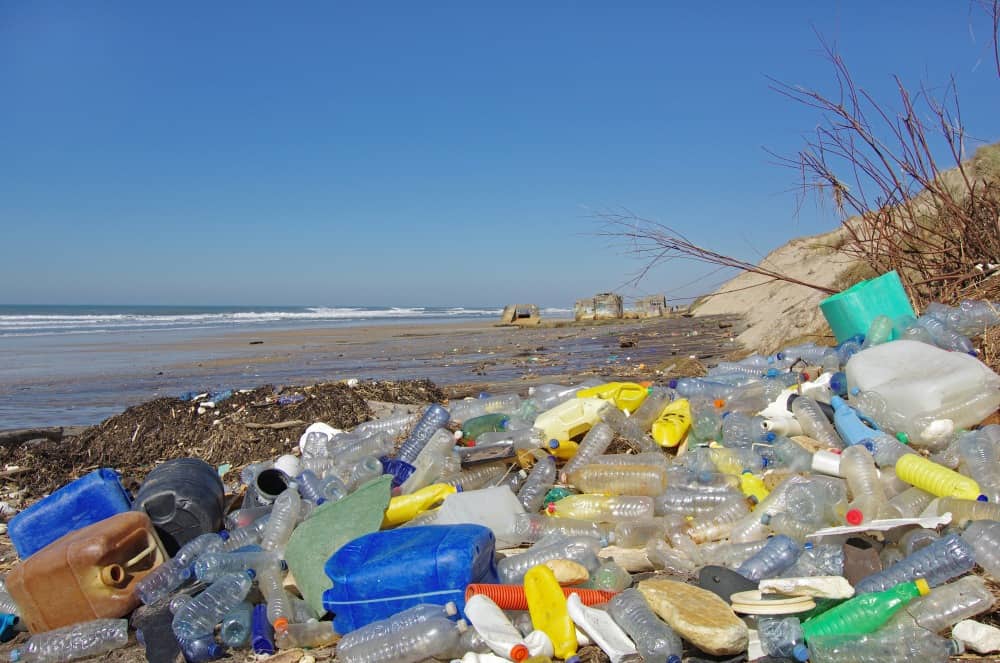 plastic bottles and waste on beach