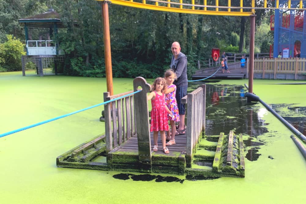 family on raft at theme park