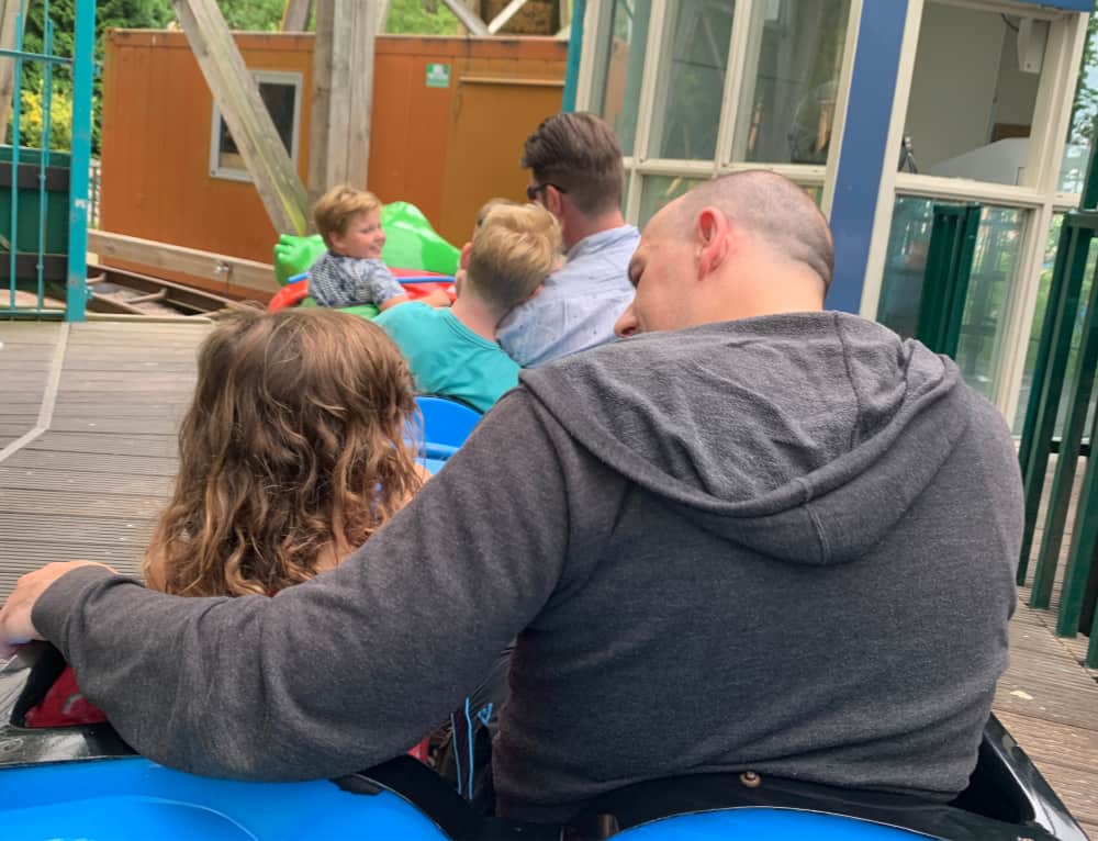 father and daughter on rollercoaster at duinrell