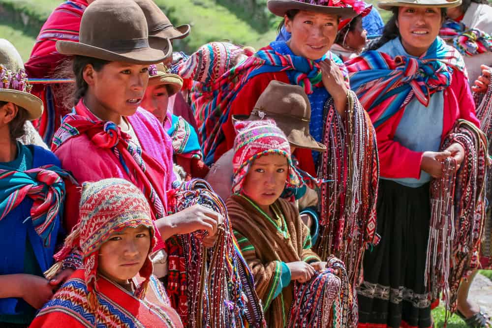 PISAC, PERU - MARCH 5, 2006: Unidentified people at Inca citadel in Sacred Valleyl near Pisac in Peru. Sacred Valley of the Incas is a valley in the Southern Sierra that contains many famous and beautiful Inca ruins