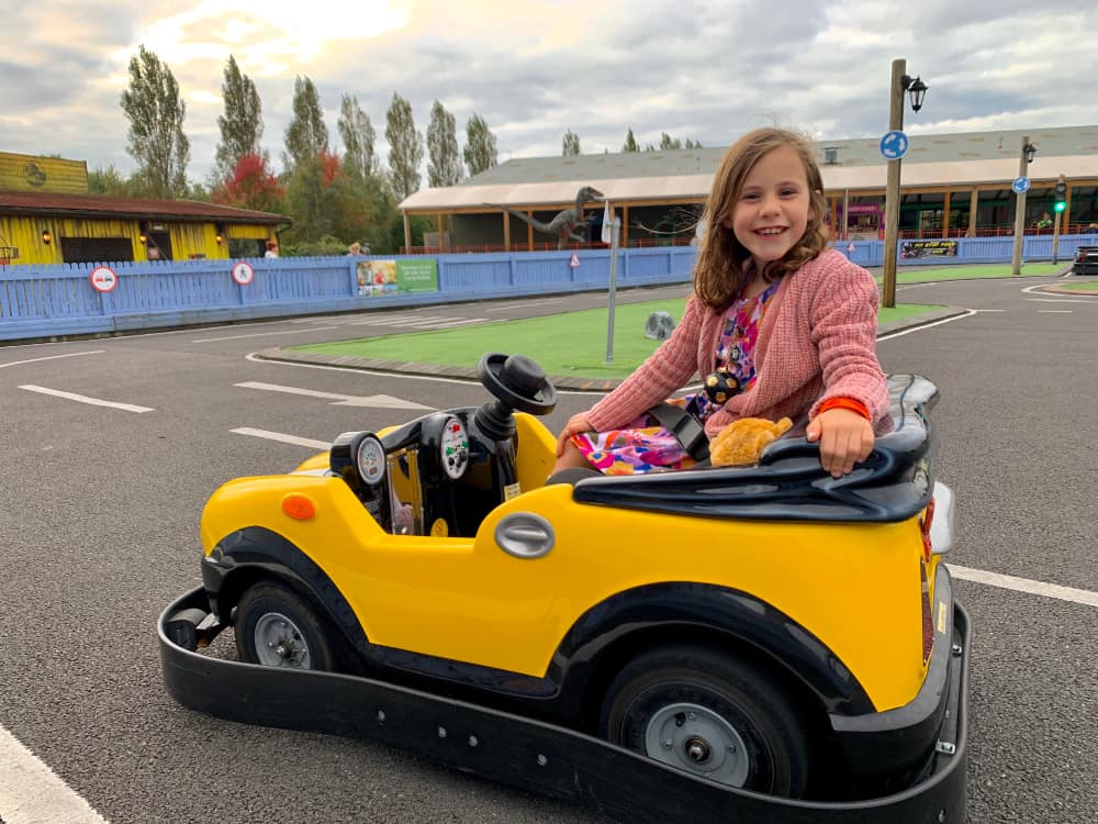 child in car at driving school crealy