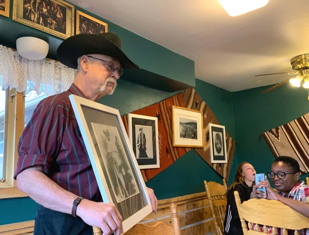 man holding picture at dude ranch