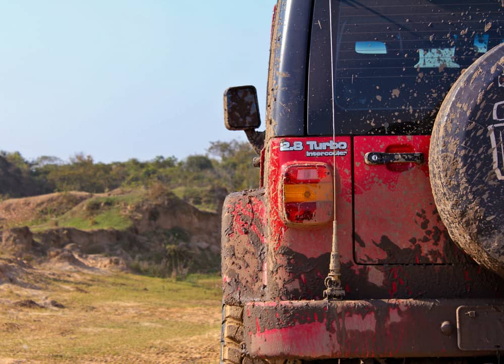 Red offroad car dirt with mud