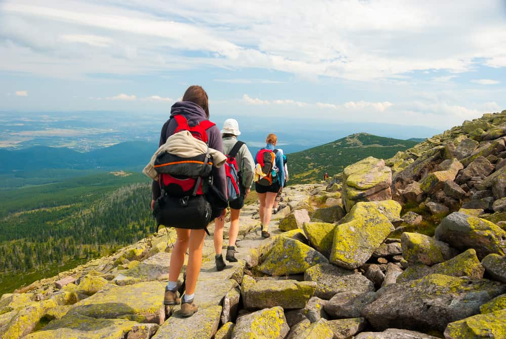 Family hiking in Karkonoszy mountains at summer