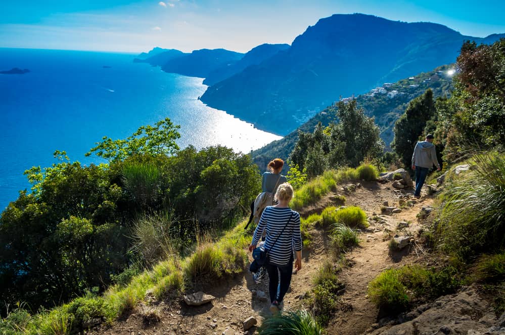 family hiking on a trail trail the Path of Gods at the Amalfi coast