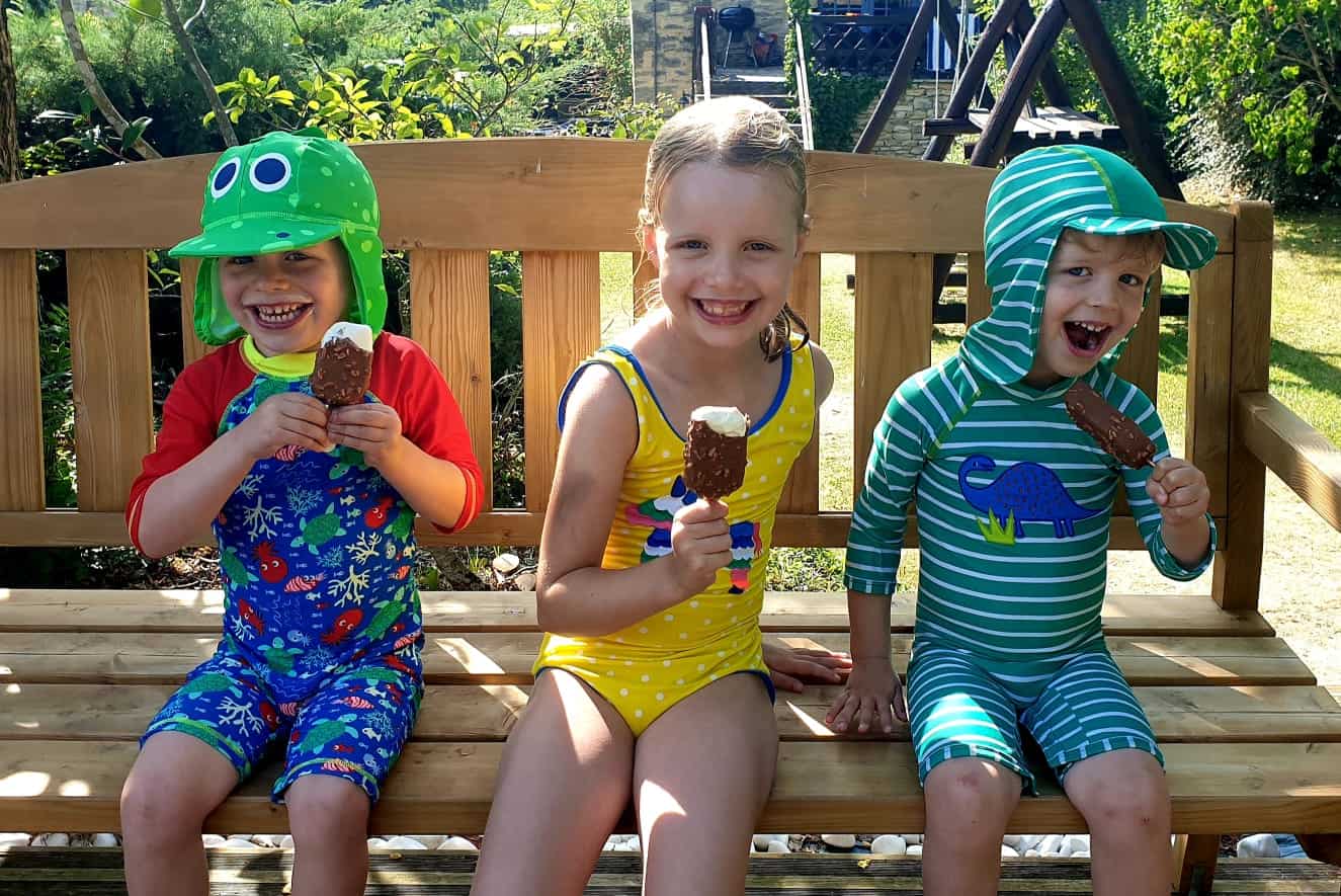 kids in swimming costumes eating ice cream